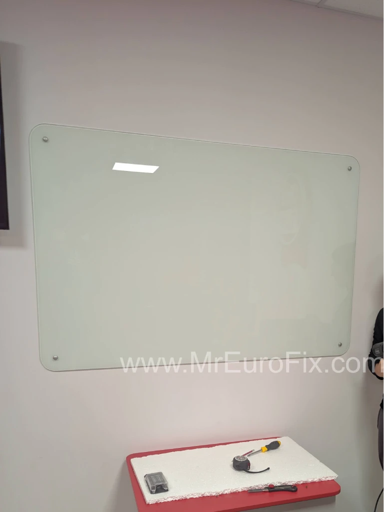 Assembling a wall-mounted marker board.