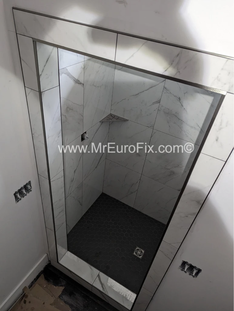 Expert shower tile installation and custom tiled doorway for a modern bathroom